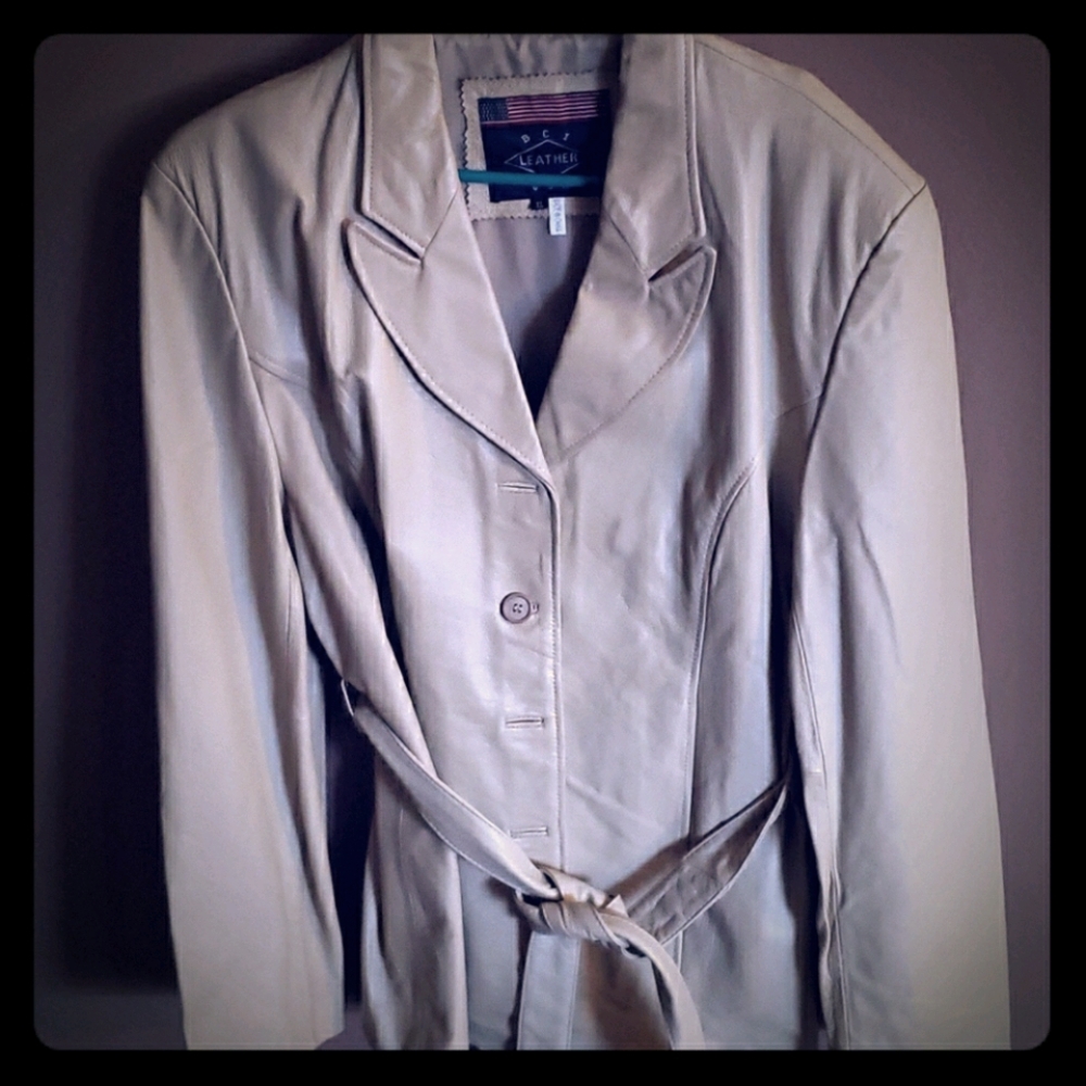 Cream color women's leather jacket.